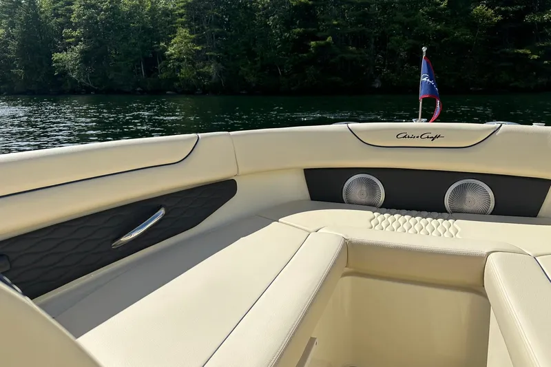 Slide: The Image of 2026 Chris-Craft Sportster 28 interior with luxurious seating and scenic lake view. - 20