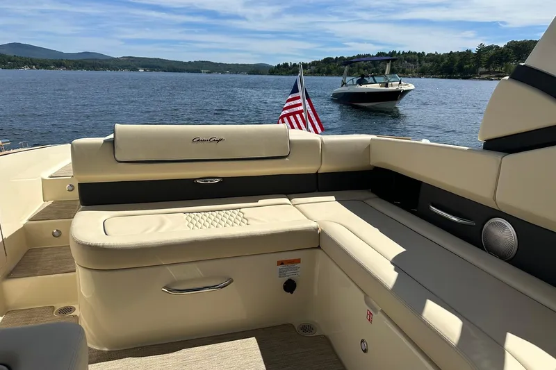 Slide: The Image of 2026 Chris-Craft Sportster 28 boat interior with lake view and American flag. - 29