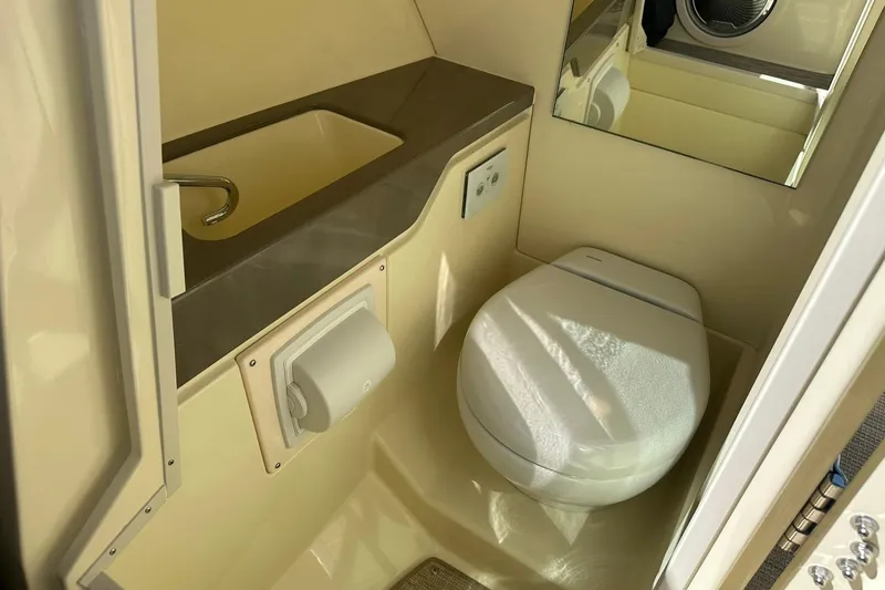 Slide: The Image of 2026 Chris-Craft Sportster 28 boat bathroom with modern sink and toilet. - 31