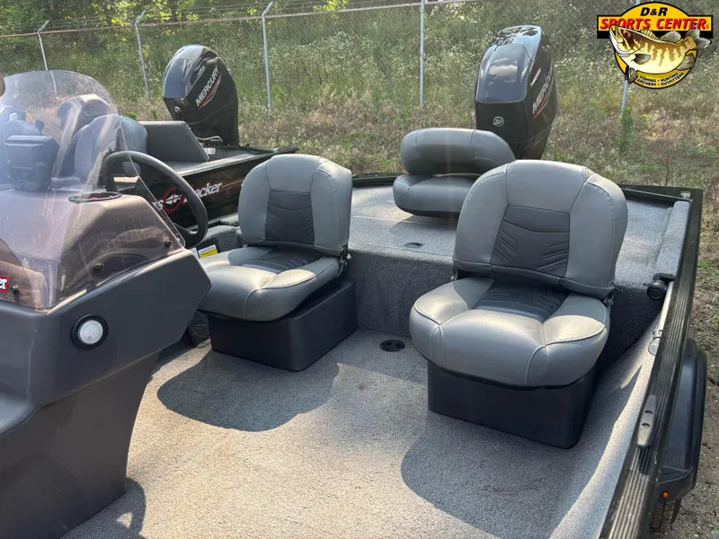 Slide: The Image of 2021 Tracker Bass Tracker Classic XL boat interior with gray seats and steering console. - 4