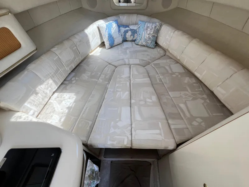 Slide: The Image of 1997 Sea Ray 270 Sundancer bathroom with sink, toilet, and storage cabinet. - 17