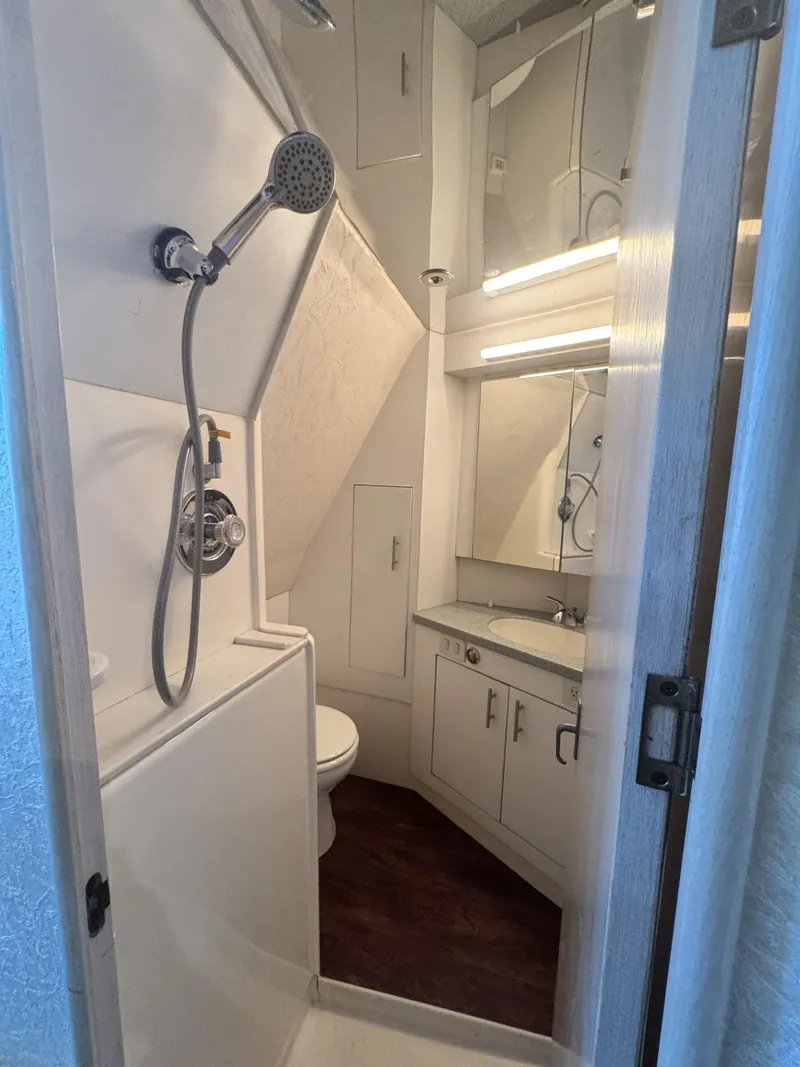 Slide: The Image of Bathroom interior of 1997 Ocean Yachts 45 Super Sport with shower and vanity. - 7