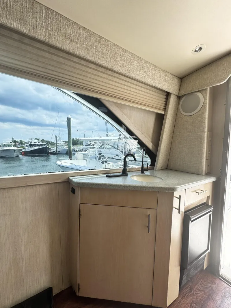 Slide: The Image of Interior of 1997 Ocean Yachts 45 Super Sport with marina view through window. - 5