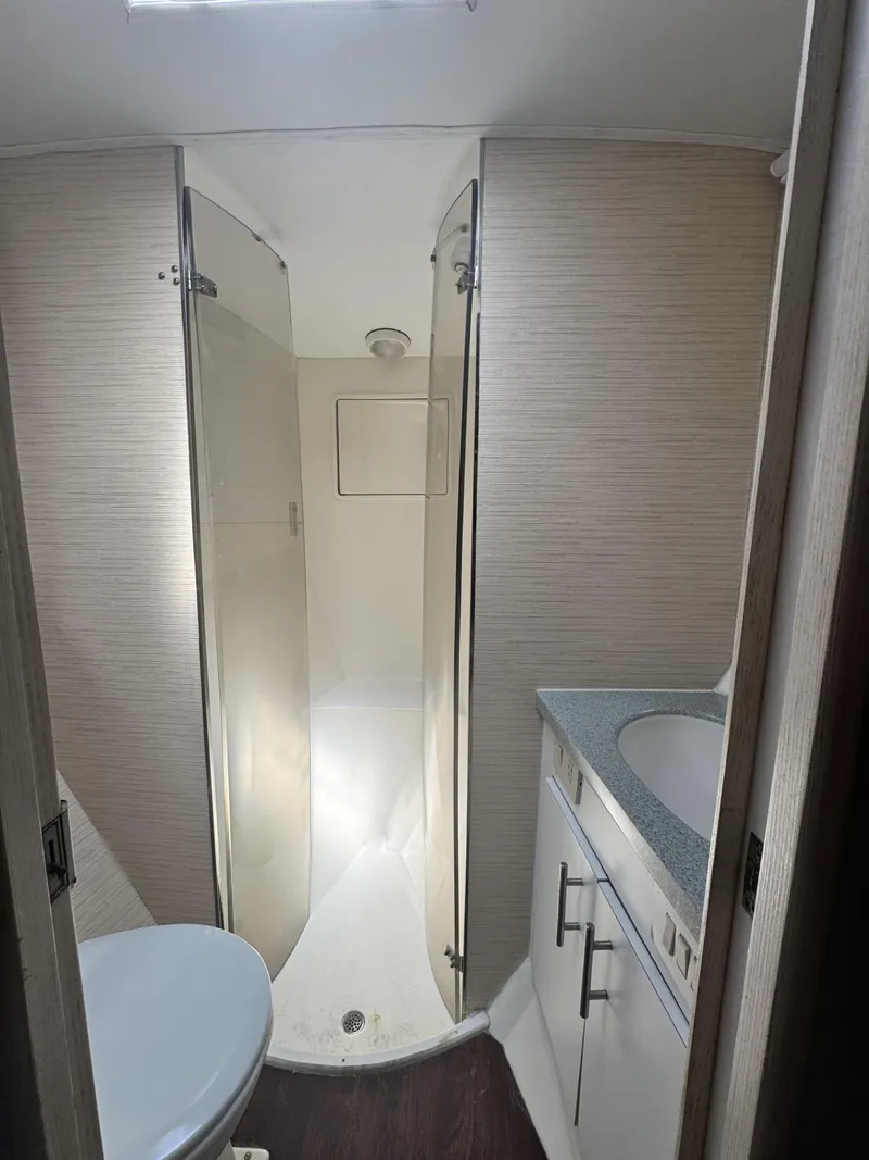 Slide: The Image of Bathroom interior of 1997 Ocean Yachts 45 Super Sport with shower, sink, and toilet. - 6