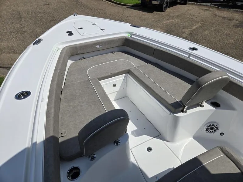 Slide: The Image of 2026 Sea Hunt Ultra 275se boat interior with gray seating and storage compartments. - 12