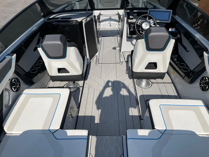 Slide: The Image of 2023 Yamaha Boats 222XD interior with modern seating and steering console. - 5