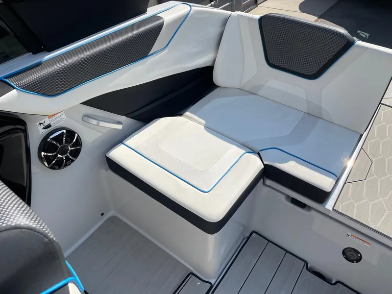 Slide: The Image of 2023 Yamaha Boats 222XD interior seating with modern design and speaker system. - 7
