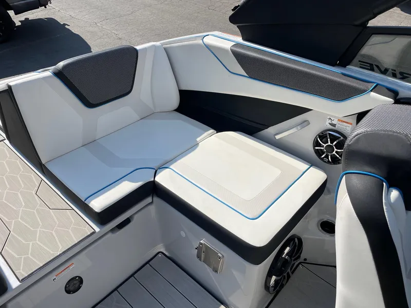 Slide: The Image of 2023 Yamaha Boats 222XD interior seating with modern design and speaker system. - 9