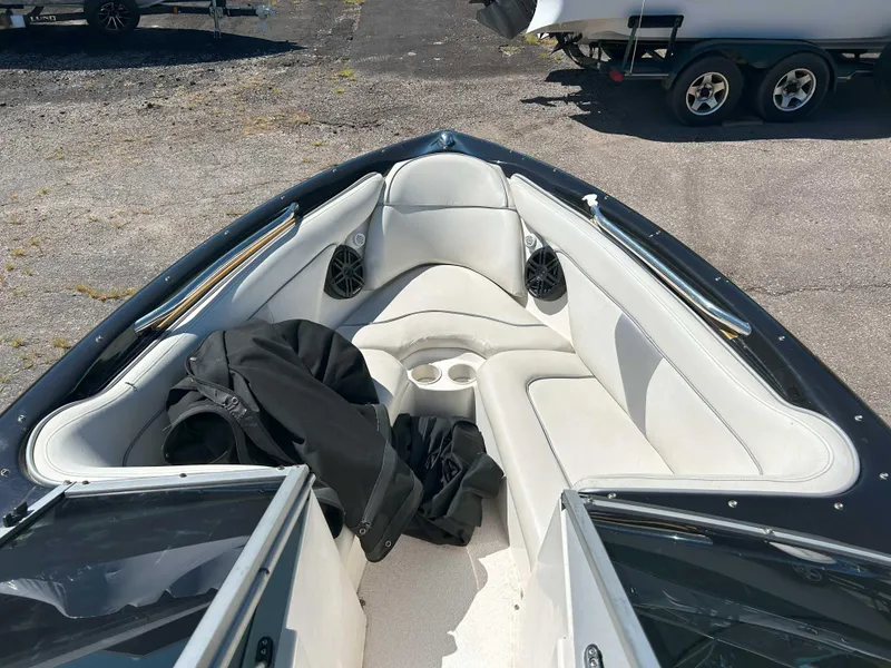 Slide: The Image of 2002 MasterCraft XStar boat interior with white seating and speakers. - 4