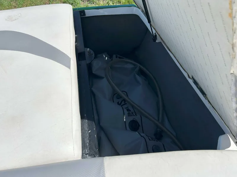 Slide: The Image of Open storage compartment in 2002 MasterCraft XStar boat with ballast bag inside. - 6