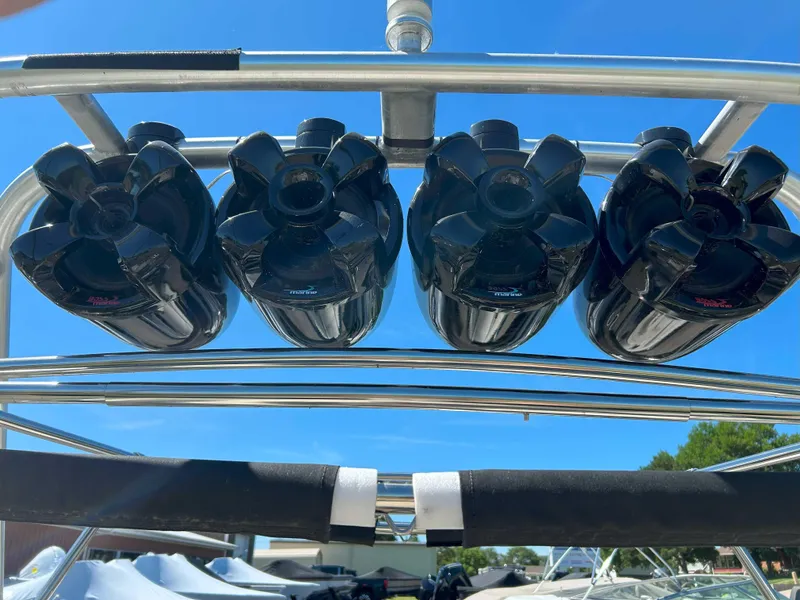 Slide: The Image of Four black speakers mounted on a 2002 MasterCraft XStar boat tower. - 8