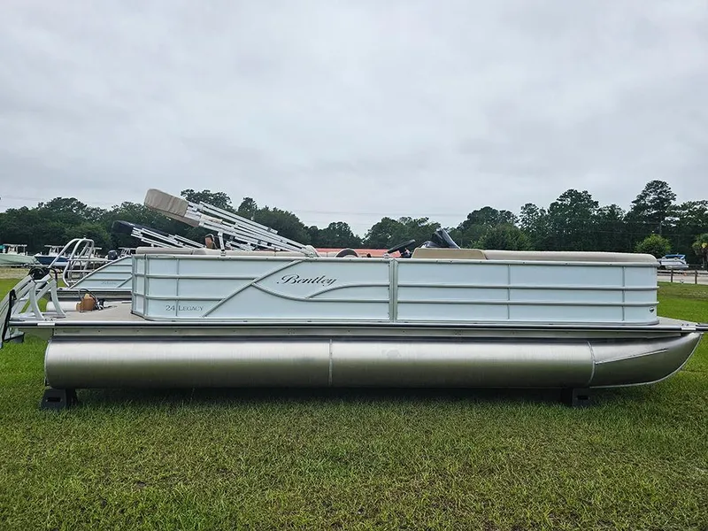 The Image of 2026 Bentley Pontoons Legacy 243 Cruise on grassy field, side view. - 1