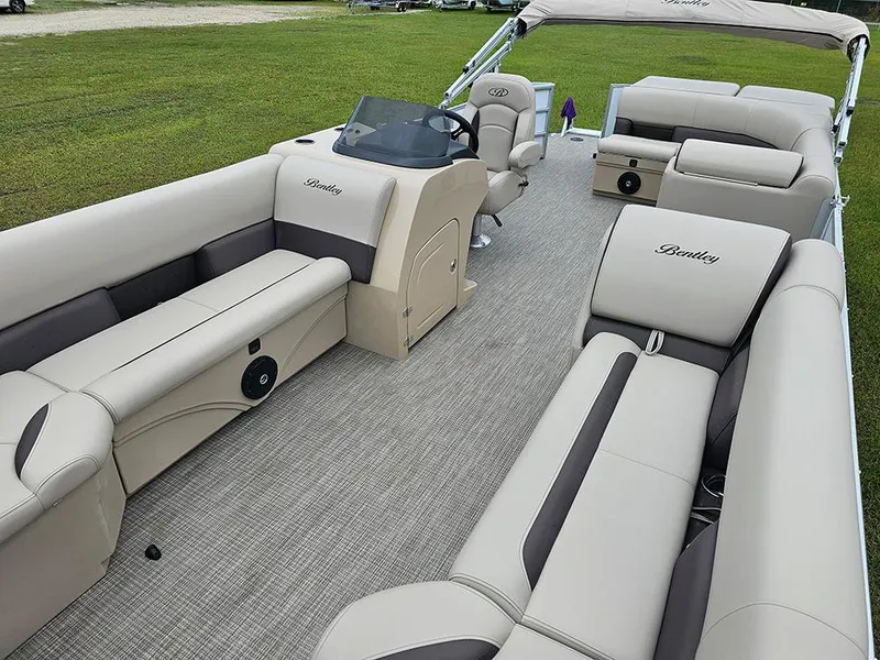 Slide: The Image of 2026 Bentley Pontoons Legacy 243 Cruise interior with luxurious seating and helm. - 10