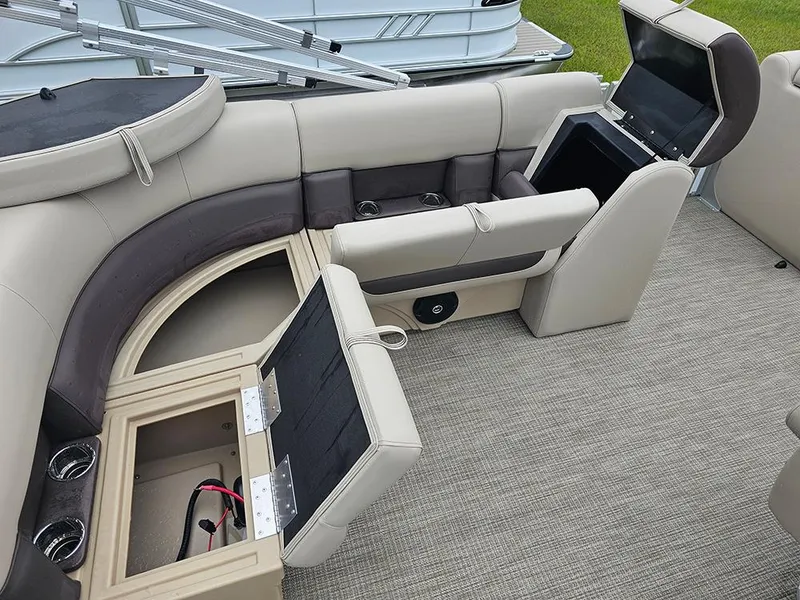 Slide: The Image of 2026 Bentley Pontoons Legacy 243 Cruise interior with open storage compartments and seating. - 13