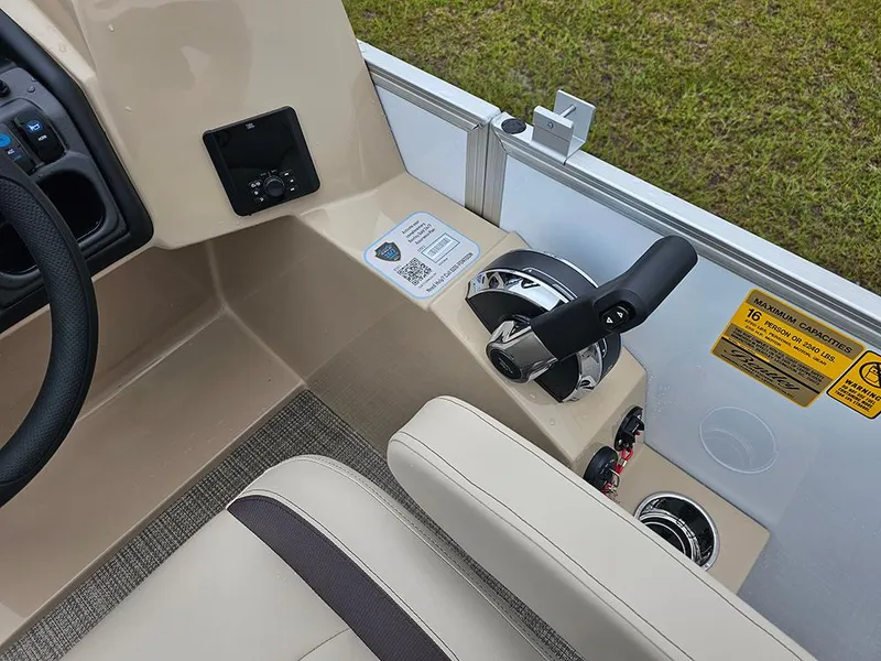Slide: The Image of Control panel of 2026 Bentley Pontoons Legacy 243 Cruise with steering and throttle. - 17