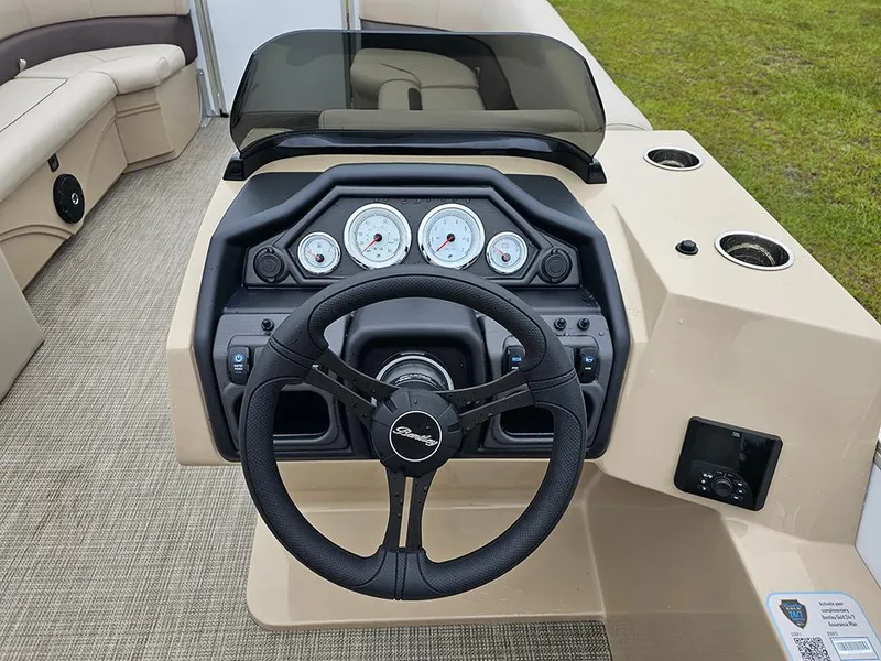 Slide: The Image of 2026 Bentley Pontoons Legacy 243 Cruise dashboard with steering wheel and gauges. - 18