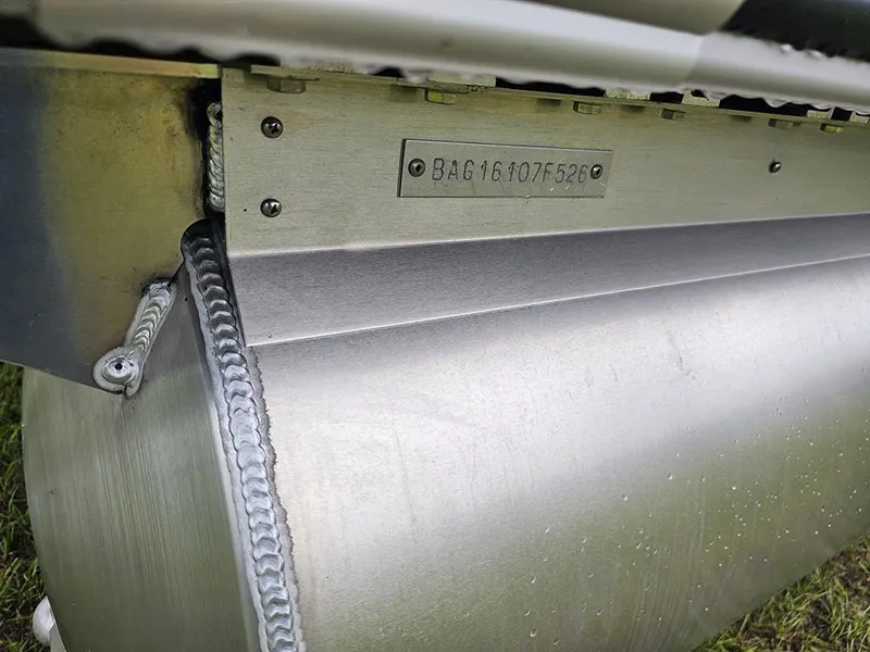 Slide: The Image of Close-up of 2026 Bentley Pontoons Legacy 243 Cruise pontoon with visible serial number and welds. - 22