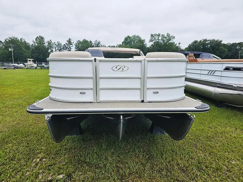 Slide: The Image of 2026 Bentley Pontoons Legacy 243 Cruise on grassy field, rear view. - 4