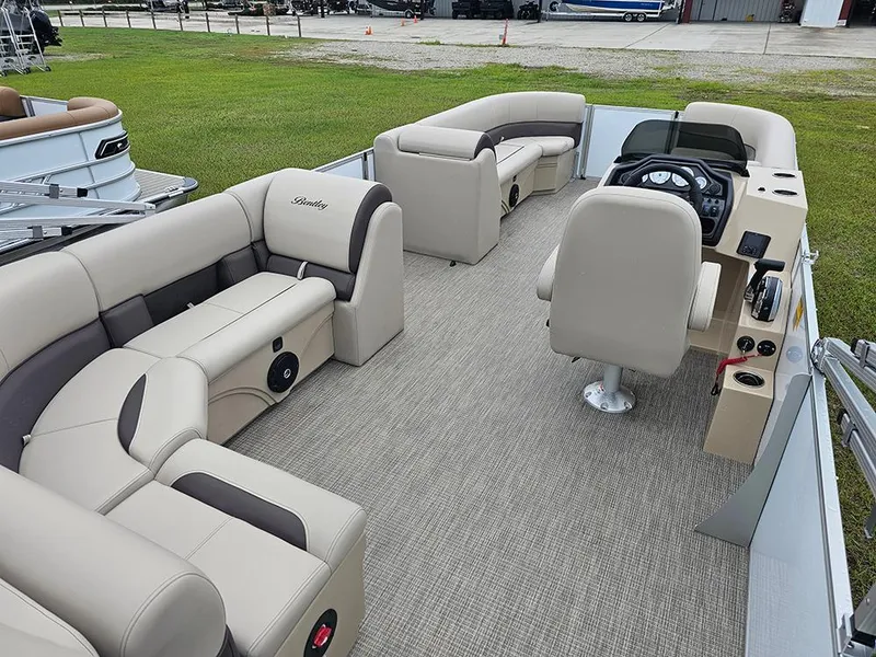 Slide: The Image of 2026 Bentley Pontoons Legacy 243 Cruise interior with plush seating and modern helm. - 9