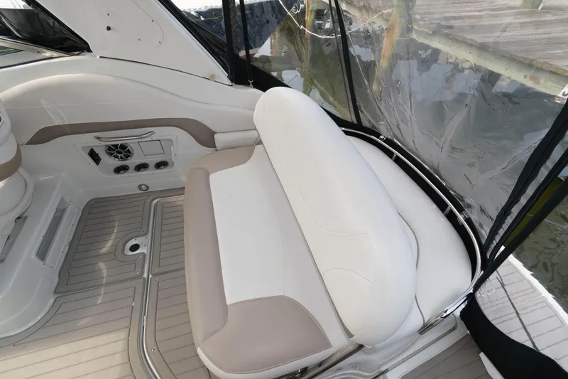 Slide: The Image of 2021 Crownline 264 CR boat interior with white and beige seating. - 1