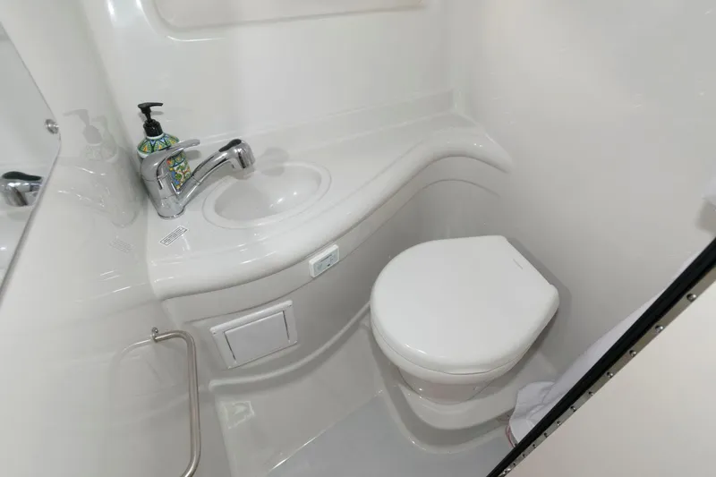 Slide: The Image of 2021 Crownline 264 CR boat bathroom with sink and toilet. - 16