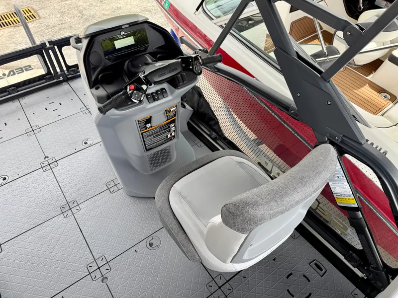 Slide: The Image of 2025 Sea-Doo Switch Sport Compact cockpit with steering controls and seating. - 8