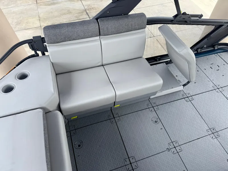 Slide: The Image of 2025 Sea-Doo Switch Sport Compact interior with gray seating and cup holders. - 9
