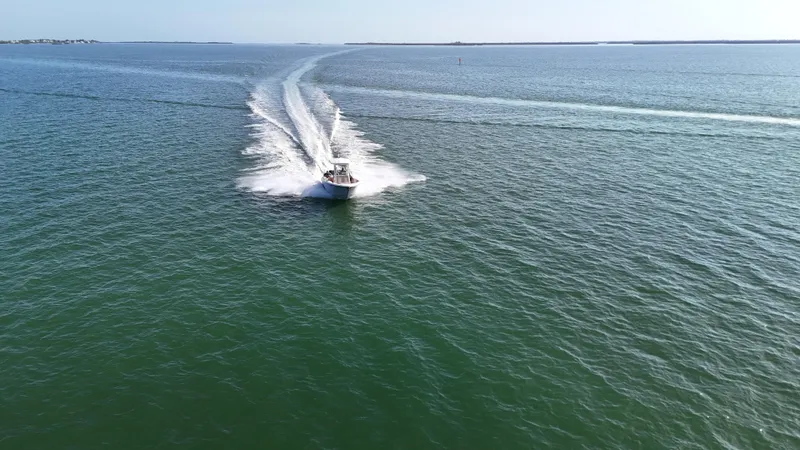 Slide: The Image of Aerial view of 2017 Sea Fox 266 Commander speeding across open water. - 11