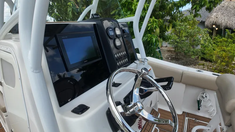 Slide: The Image of 2017 Sea Fox 266 Commander boat dashboard with steering wheel and navigation system. - 14