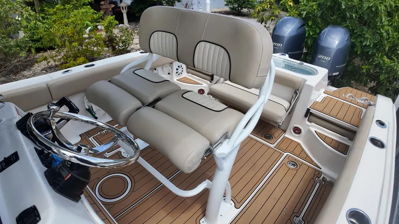 Slide: The Image of 2017 Sea Fox 266 Commander boat interior with dual engines and cushioned seating. - 20