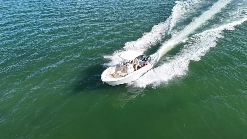 Slide: The Image of 2017 Sea Fox 266 Commander boat cruising on open water, aerial view. - 3