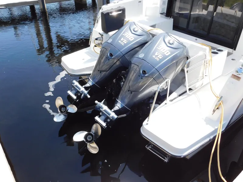 Slide: The Image of Twin Yamaha 300 V6 outboard engines on a 2021 Jeanneau NC 1095 boat. - 11