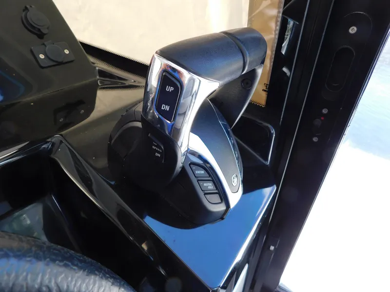 Slide: The Image of Throttle control of 2021 Jeanneau NC 1095 boat, featuring sleek design and modern controls. - 21