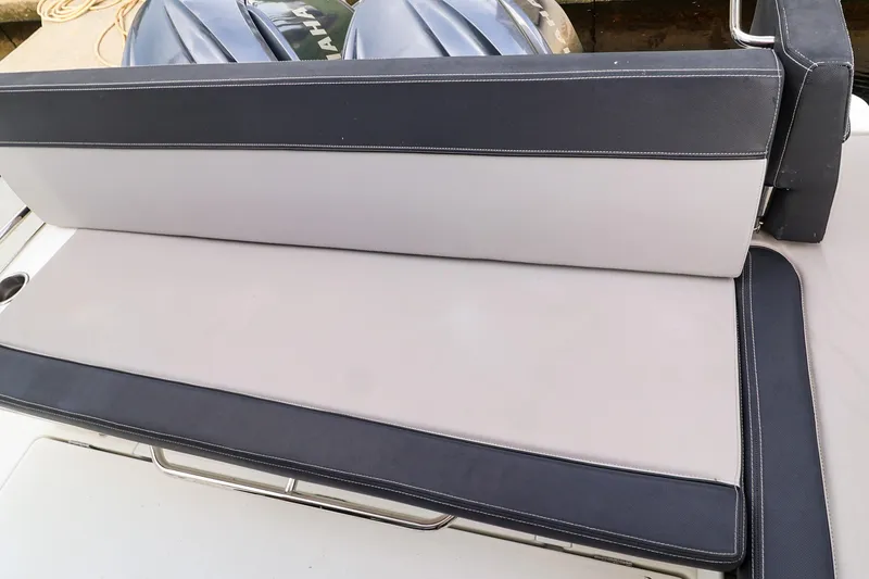Slide: The Image of 2021 Jeanneau NC 1095 boat seating with Yamaha engines in the background. - 16
