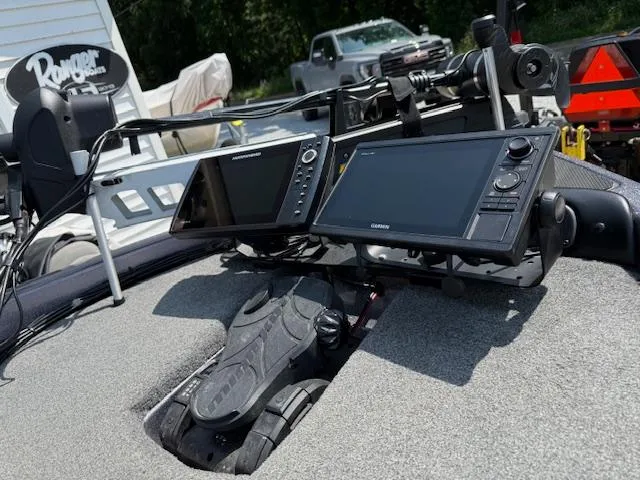 Slide: The Image of 2018 Phoenix 920 ProXP boat dashboard with dual Garmin fishfinders and control pedals. - 6