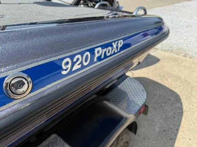 Slide: The Image of 2018 Phoenix 920 ProXP boat, close-up of model name on blue and black exterior. - 9