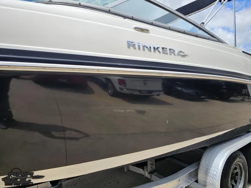Slide: The Image of 2007 Rinker 246 Captiva Bowrider on trailer, side view with logo visible. - 20