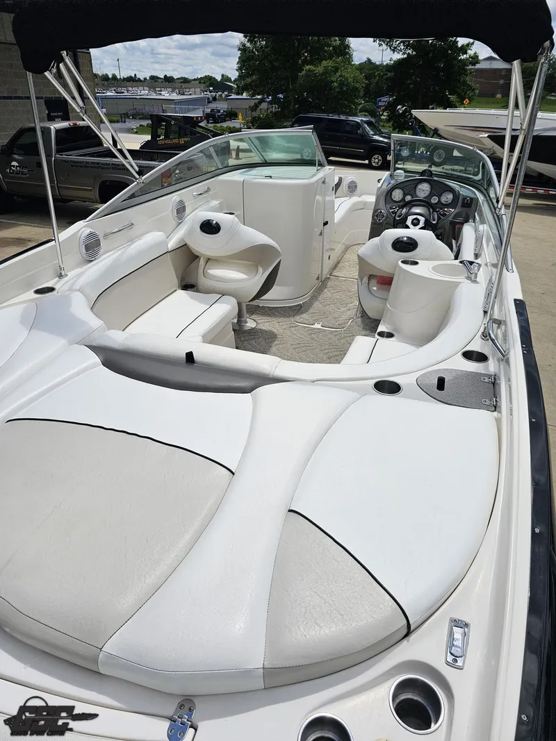 Slide: The Image of 2007 Rinker 246 Captiva Bowrider with spacious seating and modern dashboard. - 32
