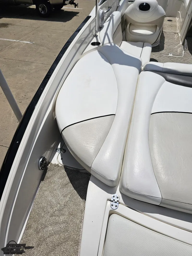 Slide: The Image of 2007 Rinker 246 Captiva Bowrider interior with white cushioned seating. - 38