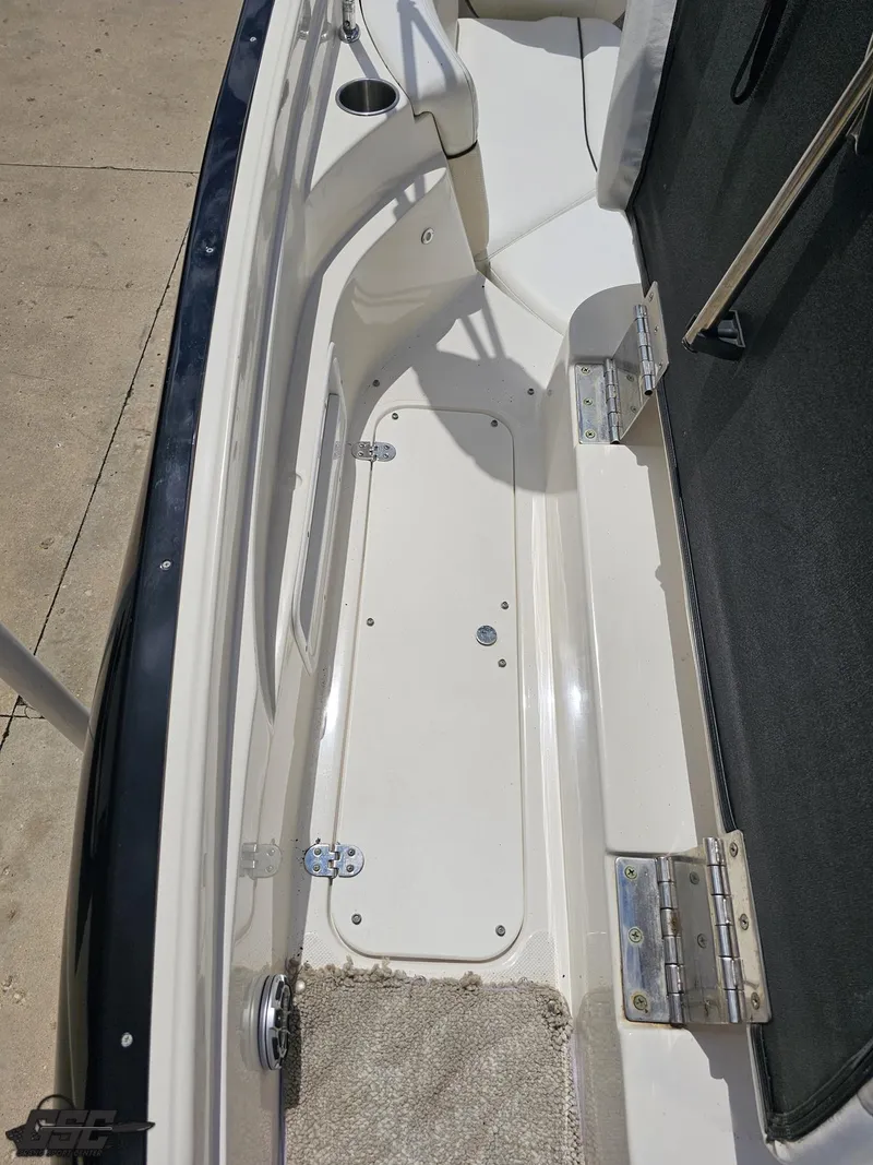 Slide: The Image of 2007 Rinker 246 Captiva Bowrider interior, showing seating and storage compartment. - 39