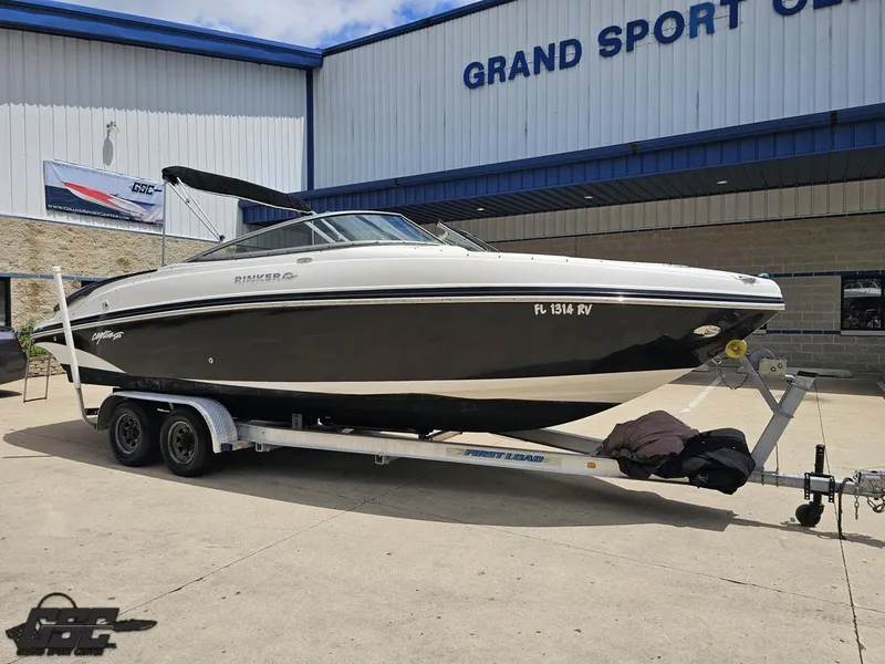 Slide: The Image of 2007 Rinker 246 Captiva Bowrider on trailer outside Grand Sport Center. - 8