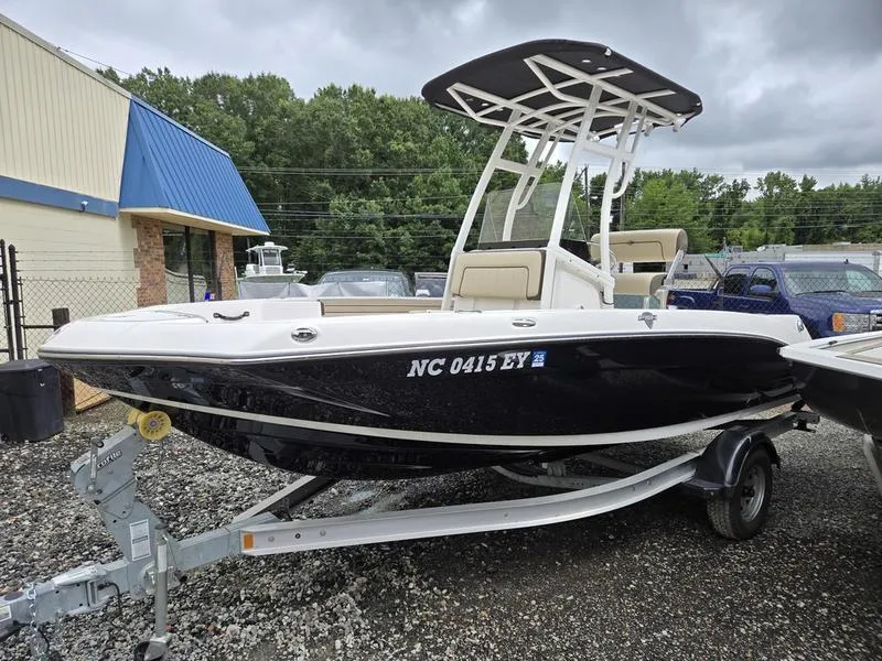 Slide: The Image of 2022 Yamaha Boats 195 FSH® SPORT on trailer, parked outdoors, overcast sky. - 3