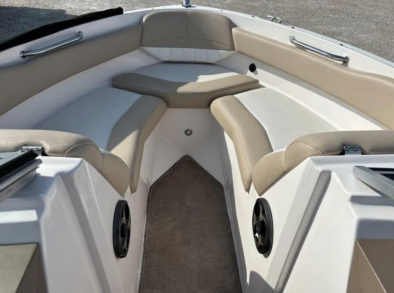Slide: The Image of 2013 Regal 2000 ES boat interior with beige seating and carpeted floor. - 3