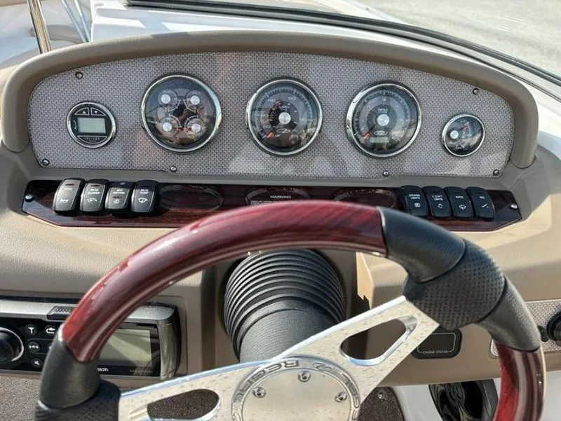 Slide: The Image of Dashboard of a 2013 Regal 2000 ES boat with gauges and controls. - 5