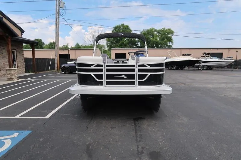 Slide: The Image of 2026 Bennington S Quad Bench 20 SSR pontoon boat parked outside dealership. - 7