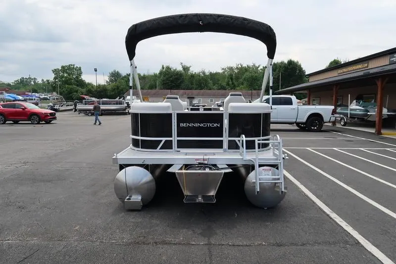 Slide: The Image of 2026 Bennington S Quad Bench 20 SSR pontoon boat parked in a lot. - 8