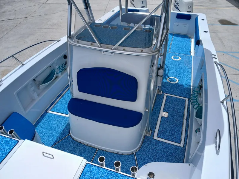 Slide: The Image of 2002 ProKat 2860 Center Console boat interior with blue seating and deck. - 5