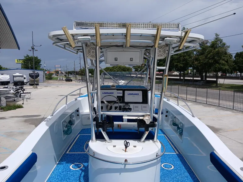 Slide: The Image of 2002 ProKat 2860 Center Console boat with blue deck, equipped with Lowrance electronics. - 6