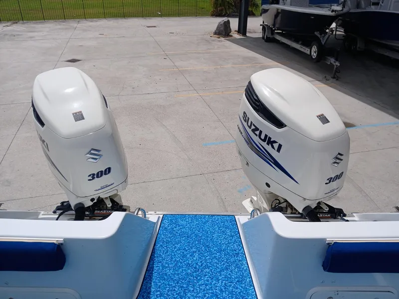 Slide: The Image of Twin Suzuki 300 outboard motors on a 2002 ProKat 2860 Center Console boat. - 7