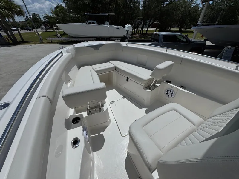 Slide: The Image of 2026 Sailfish 272 CC boat interior with white seating and modern design. - 24